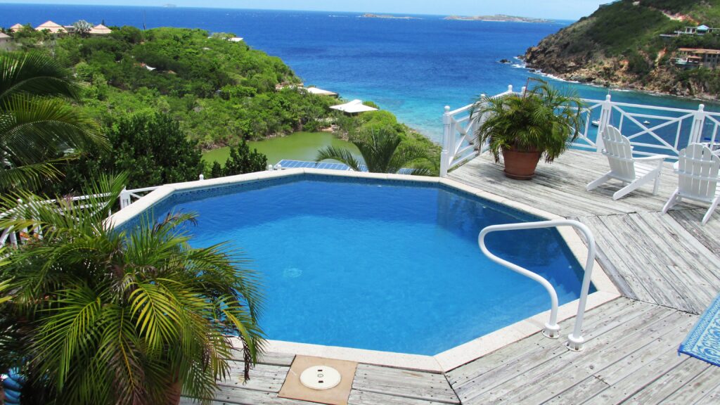 An inground pool with a blue lagoon finish.