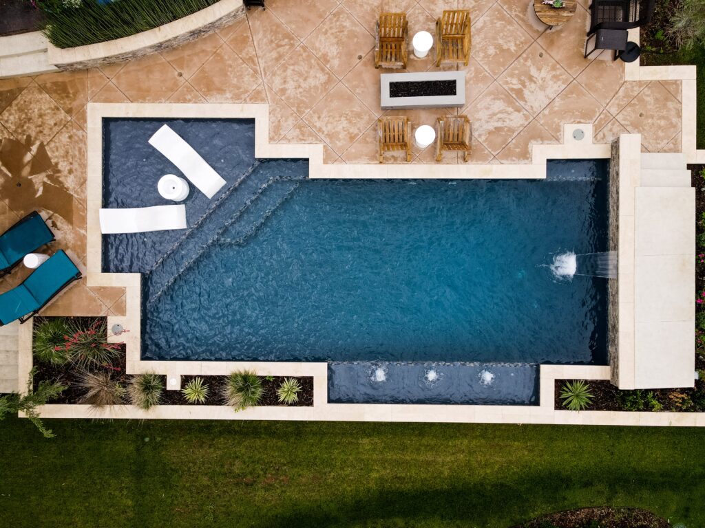 An inground pool with a midnight blue finish.