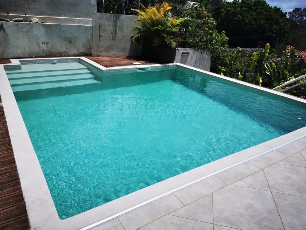 Inground pool with a sahara sand colored coating from ecoFINISH.