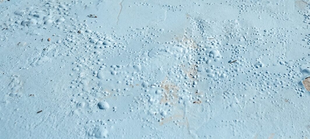 Featured image for “What Causes Bubbling or Peeling on a Pool Surface?”